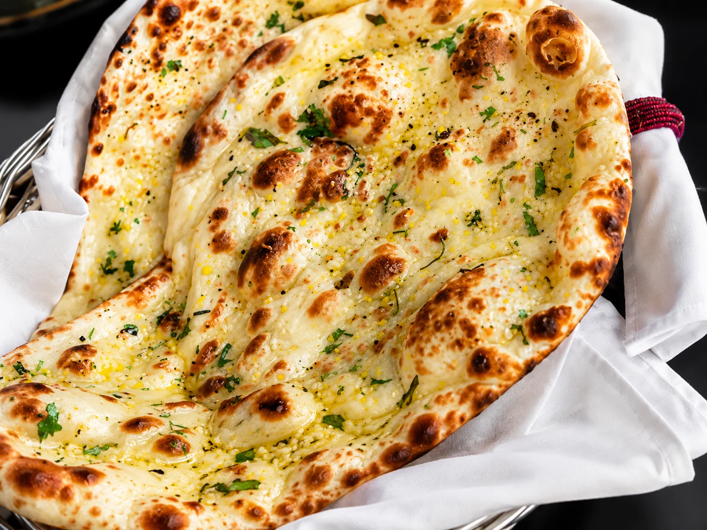 Fresh Garlic Naan at New Asian Village West Edmonton - tandoor baked flatbread